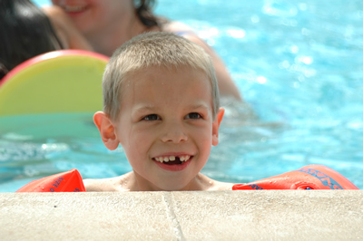 Child swimming in an indoor pool