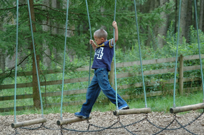 Child playing in a play area